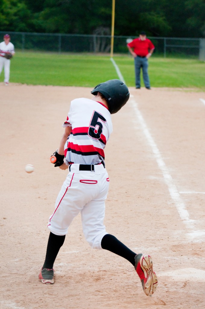 Youth hitter working on swing mechanics during a hitting lesson