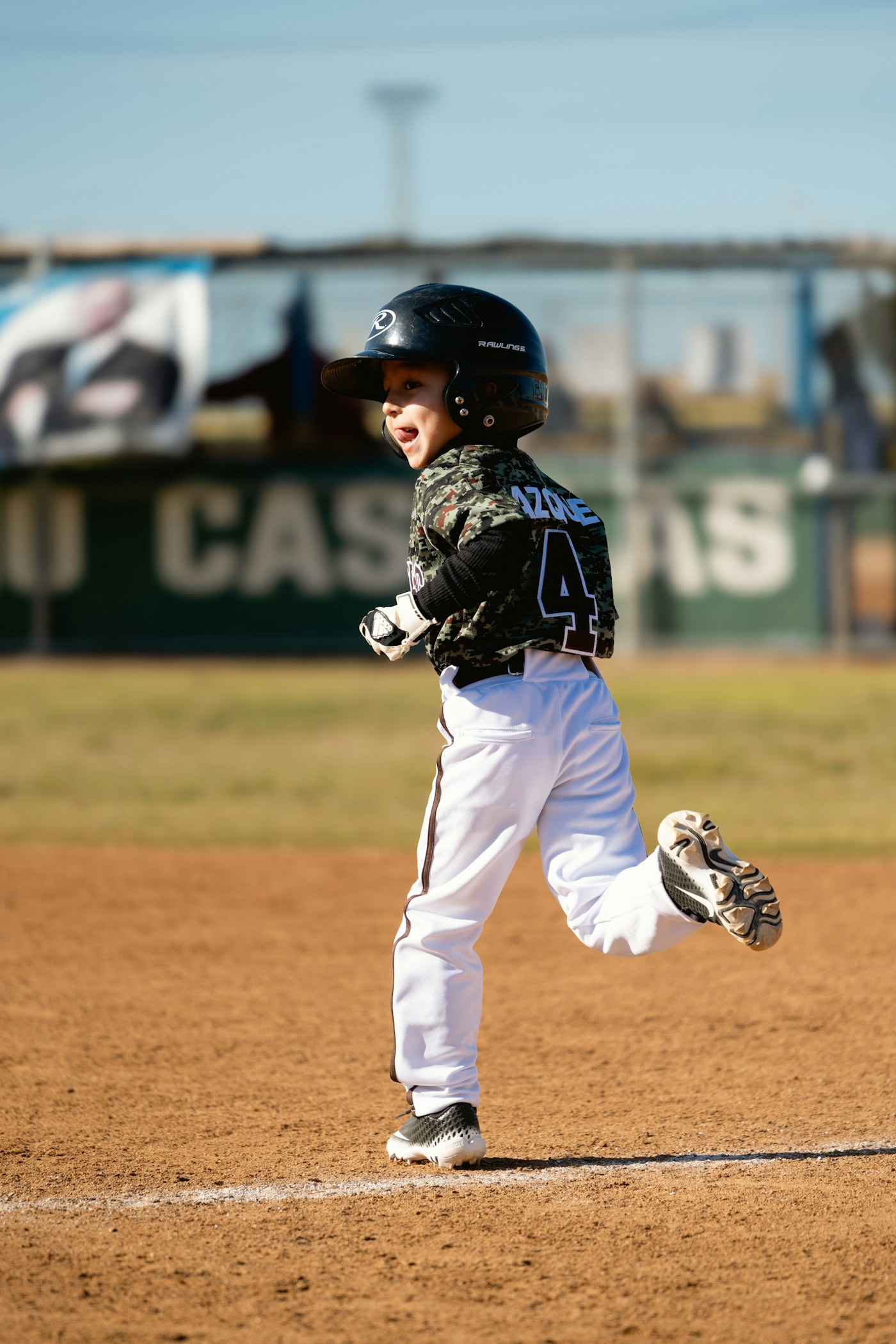 Youth baseball player running the bases during a game