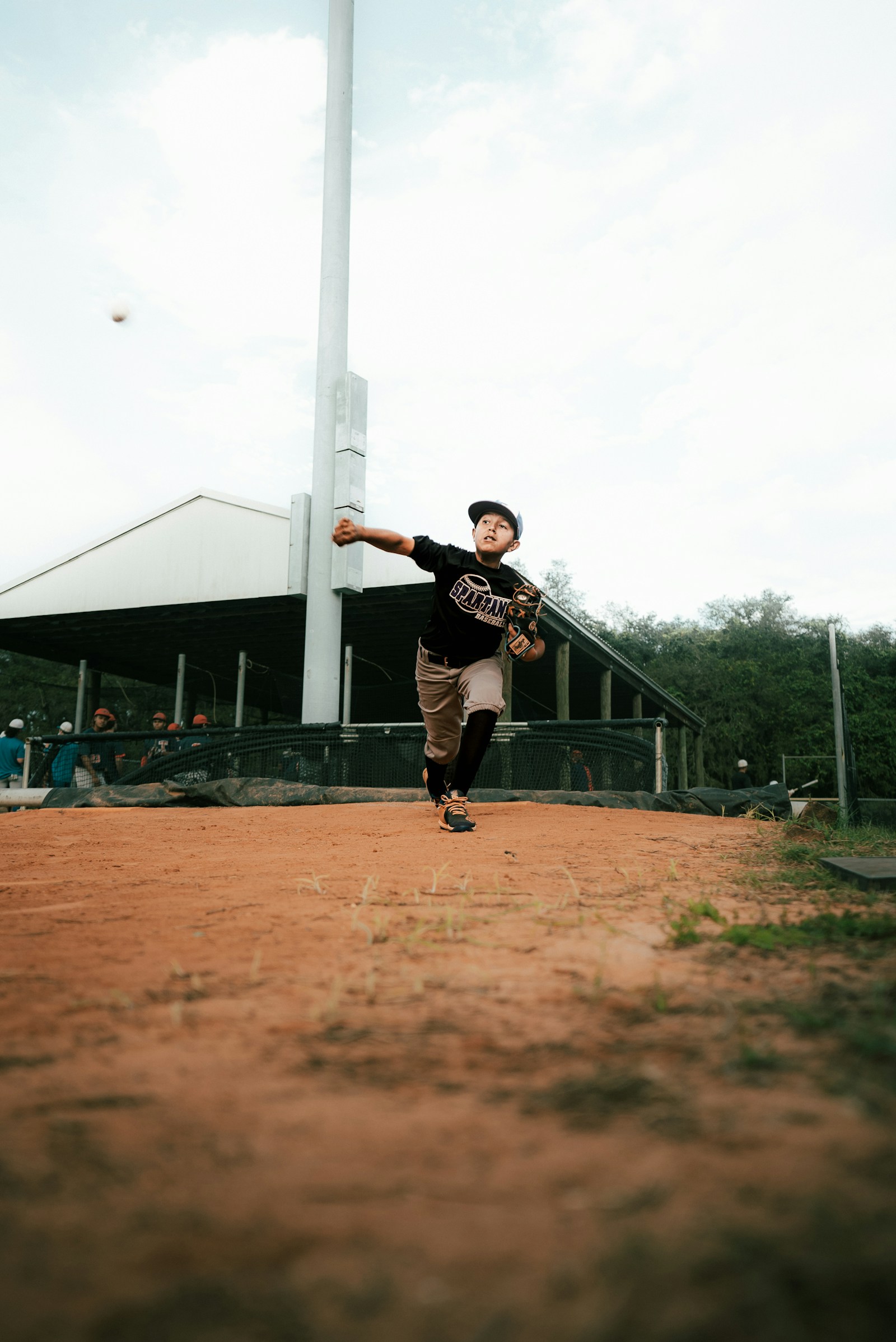 Youth pitcher on the mound during a game